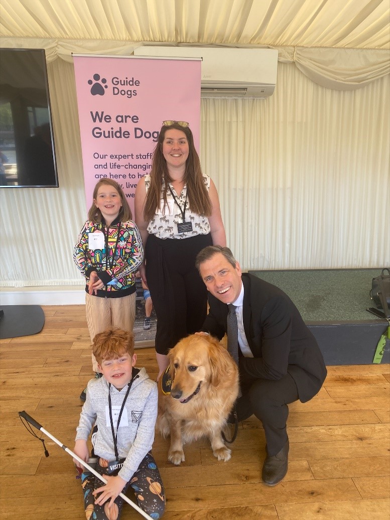 Chris Evans MP pictured with buddy dog Vesper and his owners Rubin, sister Molly and Mum Eve.